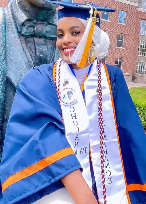 Hassina Adams, pictured in her cap and gown at Syracuse University.