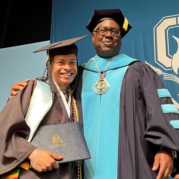 Shayne Turo (left) pictured with OCC President Dr. Warren Hilton (right) at Commencement.