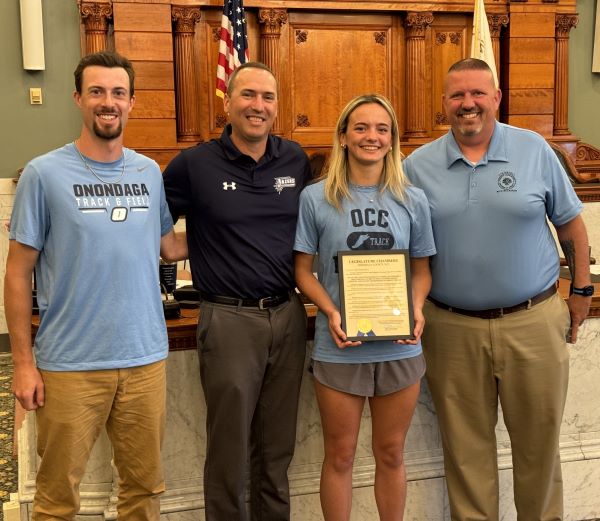 Left to right: OCC Track & Field Assistant Coach Sean Satchwell, Athletic Director Mike Borsz, Bryn Whitman, and County Legislator Richard McCarron.