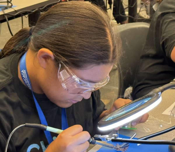 Students experimented with soldering at Micron-sponsored Chip Camp.