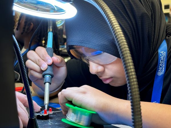 Students experimented with soldering at Micron-sponsored Chip Camp.