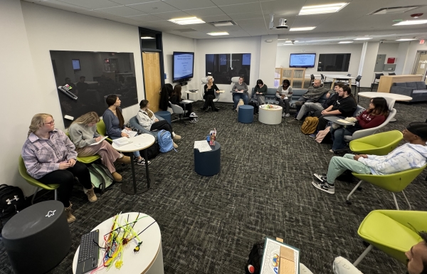 The Innovative Learning Lab provides professors the option to work with students as a large group (as pictured above) or in small group settings.