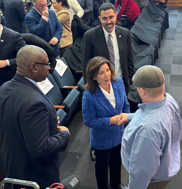 After his speech Josh Barr (right) shook hands with New York State Governor Kathy Hochul. Also pictured is OCC President Dr. Warren Hilton (left) and SUNY Chancellor John King (right).