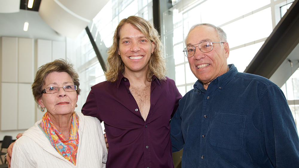 Mauro poses for a picture with his parents, Dolores (left) and John (right) after speaking with students at Onondaga.