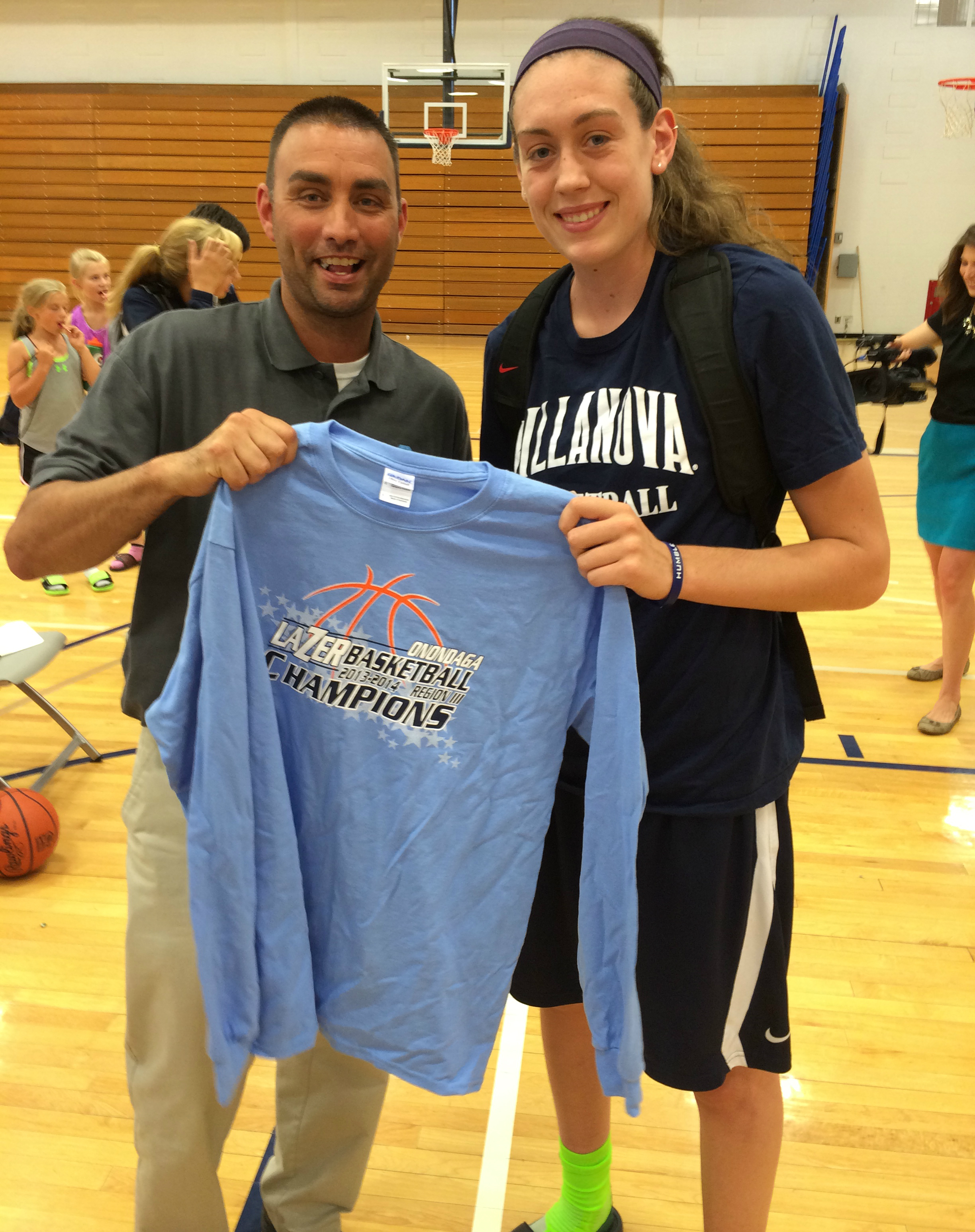 OCC Women's Basketball Coach Mike Wheeler presents Breanna with an OCC t-shirt.