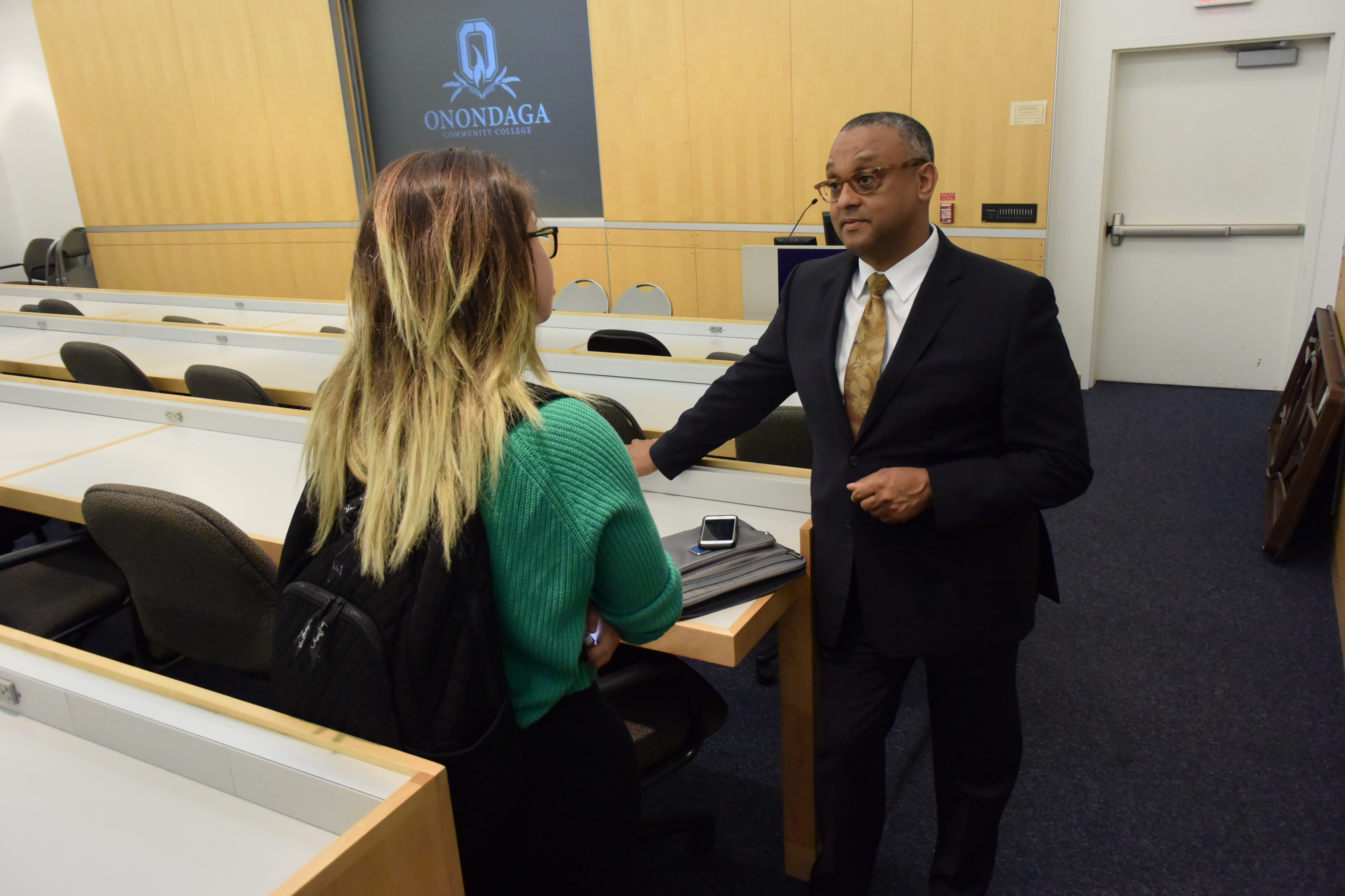 Dr. Dykes '83 talks with OCC student Niki Reyes '15 following his talk.