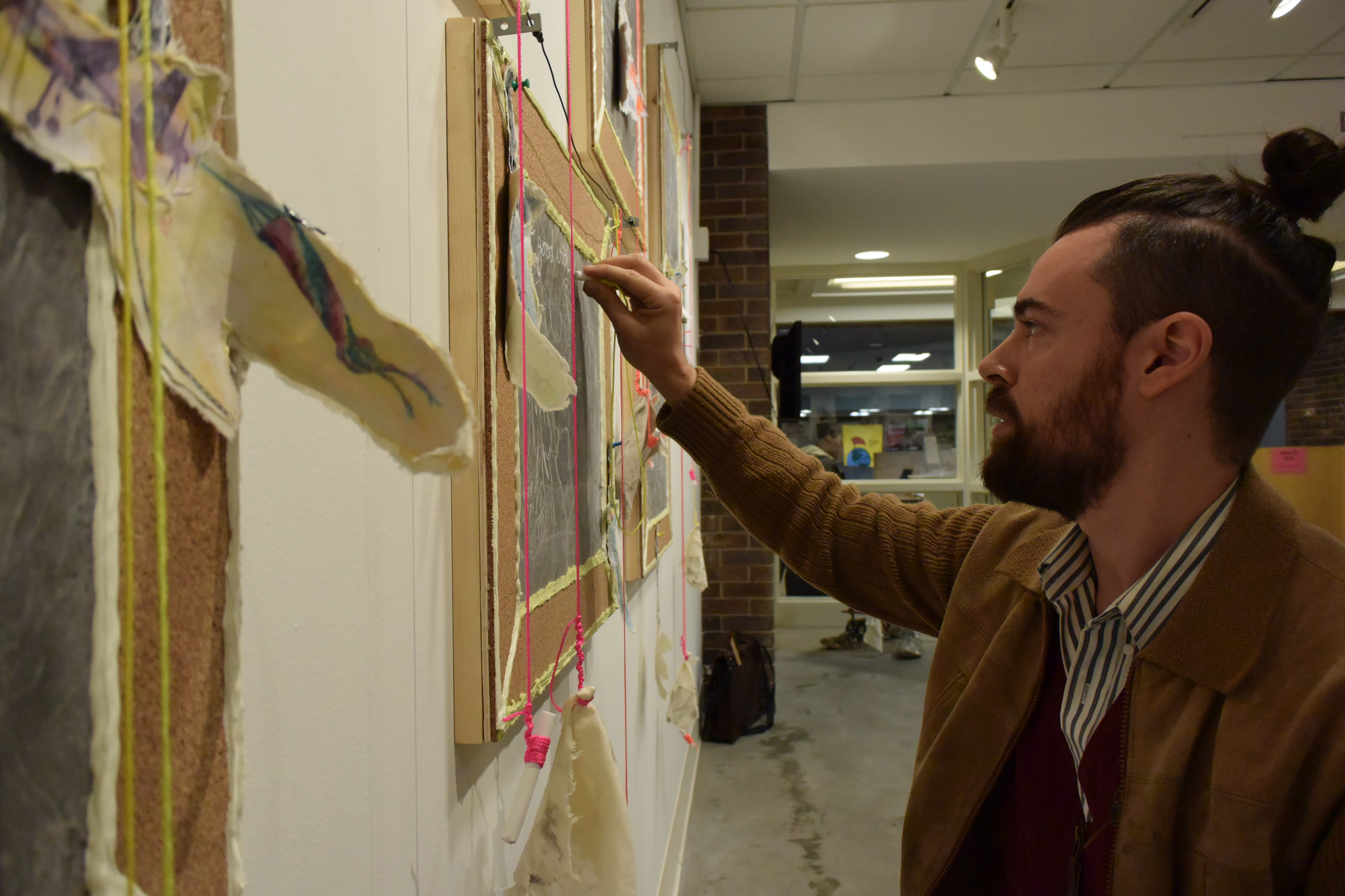 Skinner '03 works on his exhibit at the Nicholas Todisco Gallery