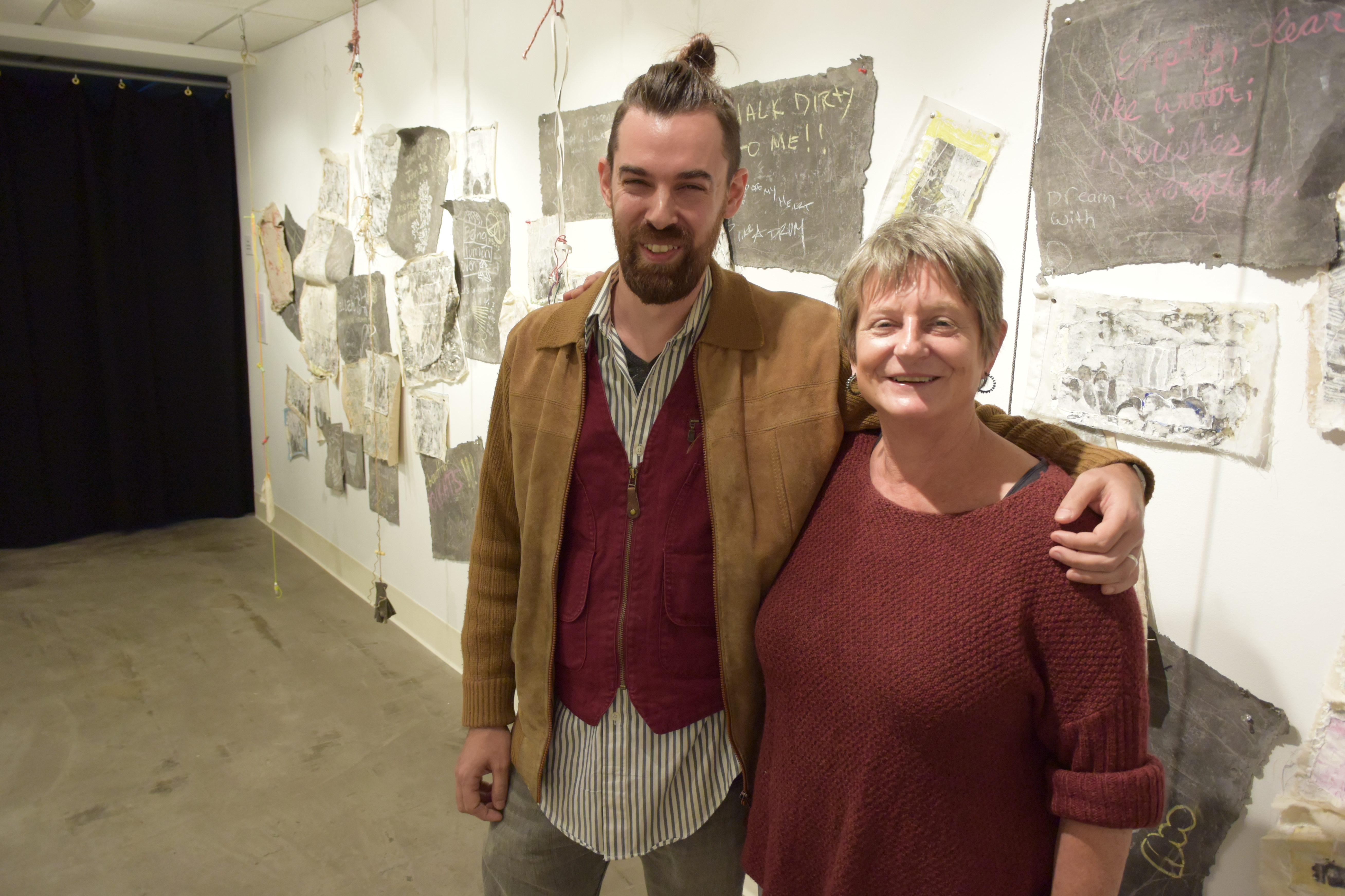 Skinner '03 poses with Art Professor Deb Haylor-McDowell at the Nicholas Todisco Art Gallery