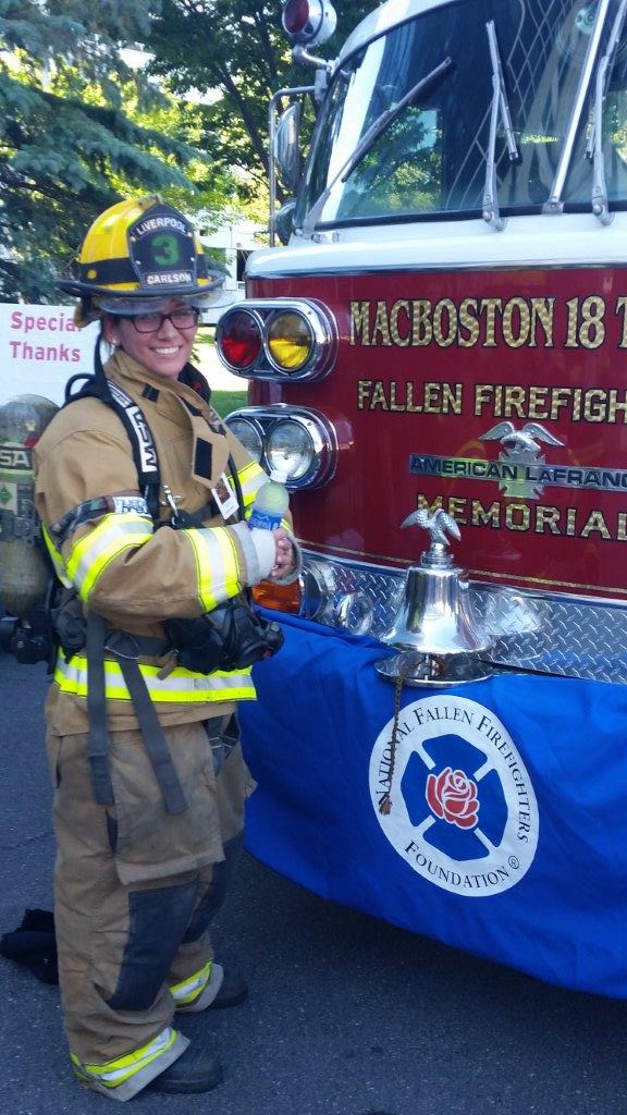 Carlson taking part in the 9/11 Memorial Stair Climb in her fire gear.