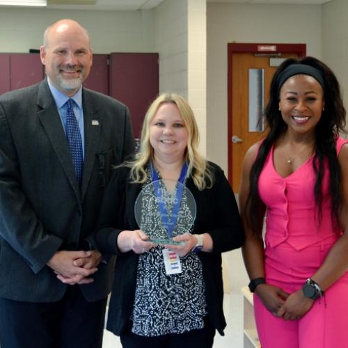 Jenniffer Bleakley of Hand In Hand Child Care Center (middle) received the 2024 New York Small Business of the Year Award from Onondaga SBDC Regional Director Robert Griffin (left) and New York State SBDC Director Sonya Smith (right).