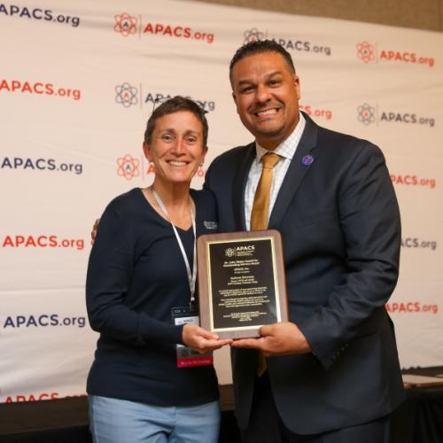 Onondaga Community College's Colleen Stevens (left) receives the Dr. John Staley Award for Outstanding Service from Renaldo D. Alba, Ed.D., President of the Association for Program Administrators of CSTEP and STEP, APACS, Inc.