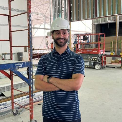 Odae Badwan '17 has returned to Onondaga Community College as a Facilities Project Manager. He's pictured in the new 2nd floor of the Whitney Applied Technology Center where the Micron Cleanroom Simulation Lab will be constructed.