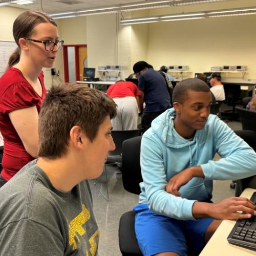 Professor Ashley Haskins works with students in the Whitney Applied Technology Center. She earned two degrees at OCC, worked in the private sector for seven years, and returned to OCC this fall as a faculty member.