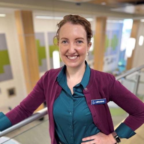 OCC Professor and Librarian Michelle Malinovsky is a member of the inaugural class of SUNY's AI for the Public Good Fellows. She's pictured in the library in Coulter Hall.