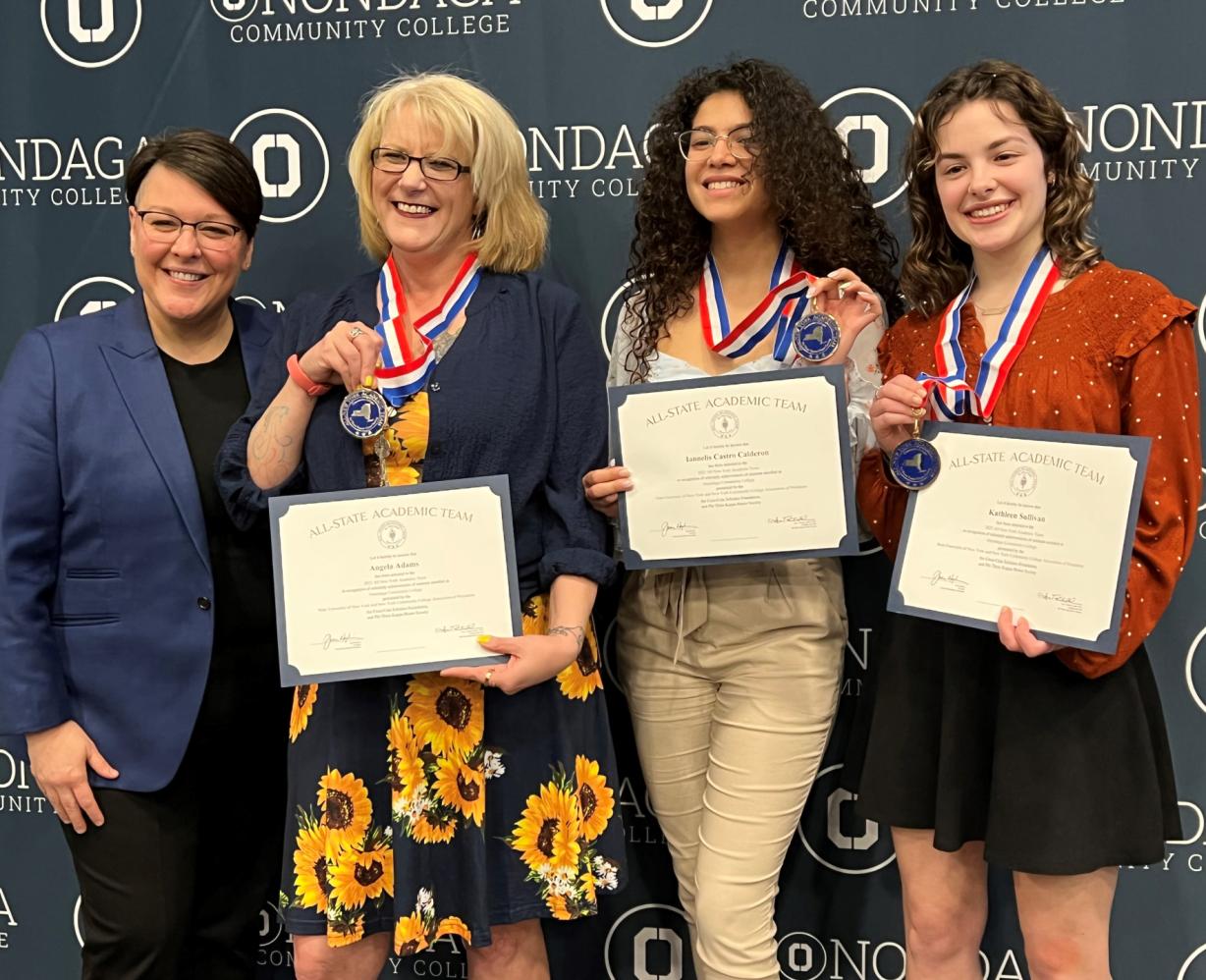 OCC's contingent at the PTK All-State ceremony include (left to right) Faculty Advisor Dr. Annie Tuttle, Angela Adams, Iannelis Castro Calderon, and Katie Sullivan. OCC's contingent at the PTK All-State ceremony include (left to right) Faculty Advisor Dr. Annie Tuttle, Angela Adams, Iannelis Castro Calderon, and Katie Sullivan.