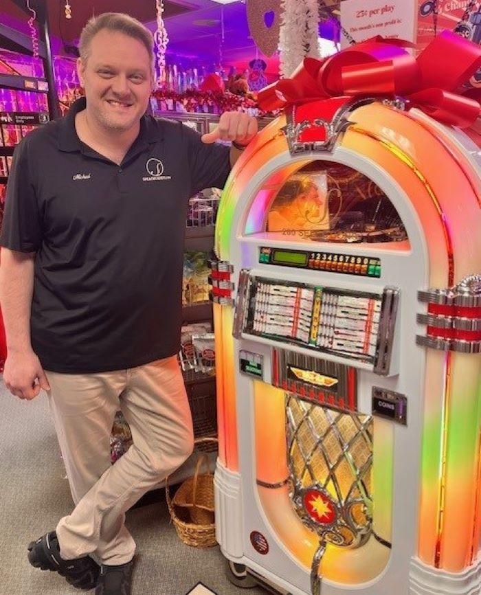 Michael Speach '02 filled a jukebox with hit records from his collection, and set it up in The Speach Family Candy Shoppe. Customers can play songs for a quarter, with the money going to local organizations. Michael Speach '02 filled a jukebox with hit records from his collection, and set it up in The Speach Family Candy Shoppe. Customers can play songs for a quarter, with the money going to local organizations.