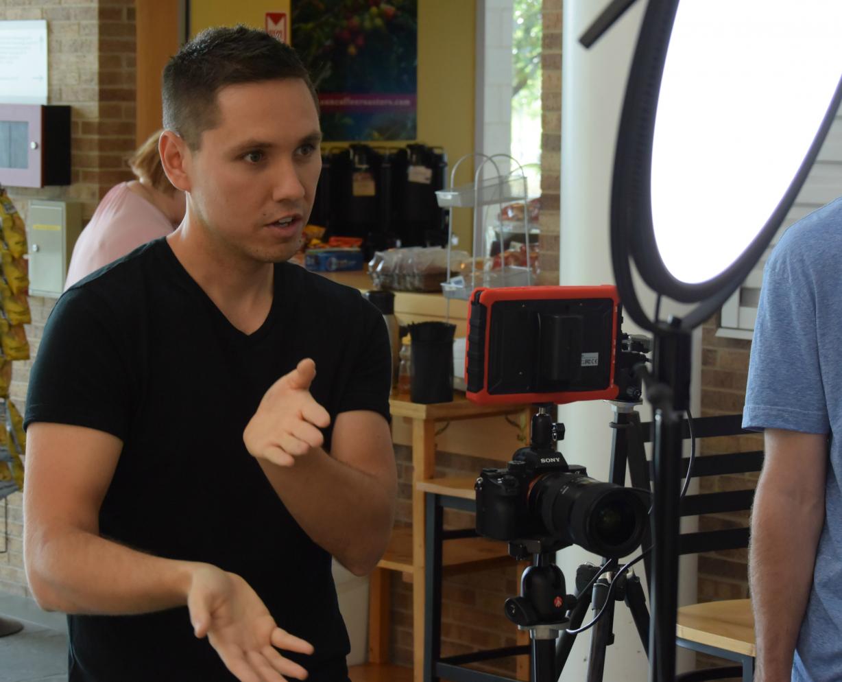 James Domroe, '02 conducts an interview during a video shoot in the Whitney Applied Technology Center. Domroe's "325 Productions" is a growing and successful content creation and social media marketing company in Central New York.